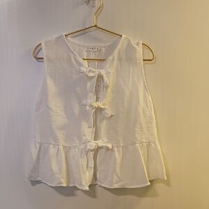 White Sleeveless Blouse with Bow Accents